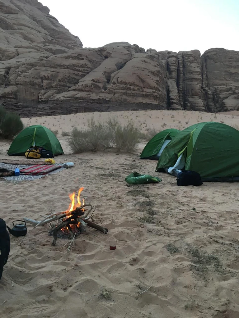 Couple of tents in the desert surrounding a campfire Wadi Rum, Jordan