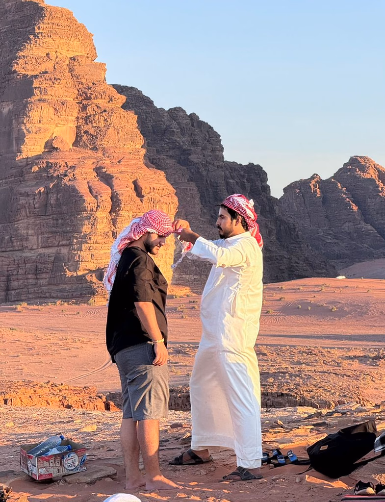 One of our Guest receiving an arabic scarf