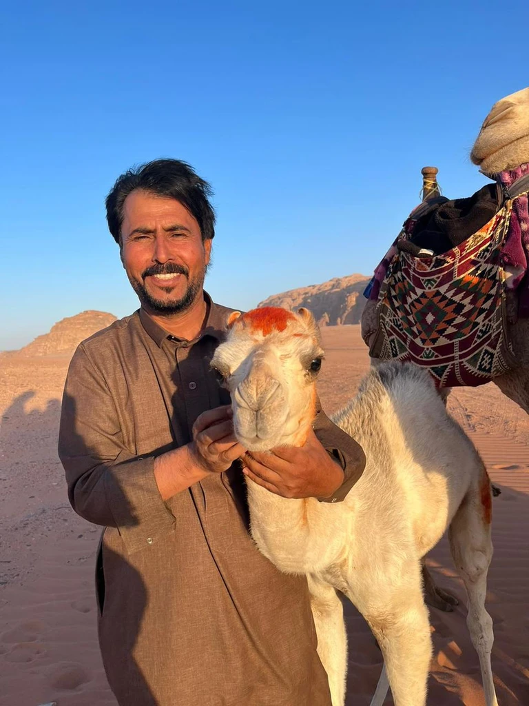 Bedouin guide with a camel in Wadi Rum, Jordan