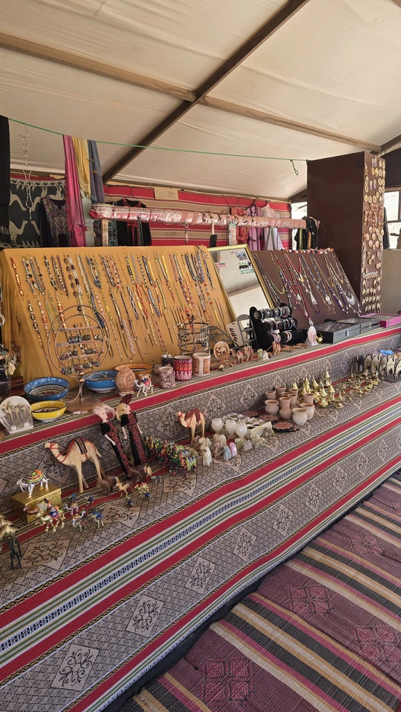 Colourful textiles and souvenirs displayed at a Bedouin market stop