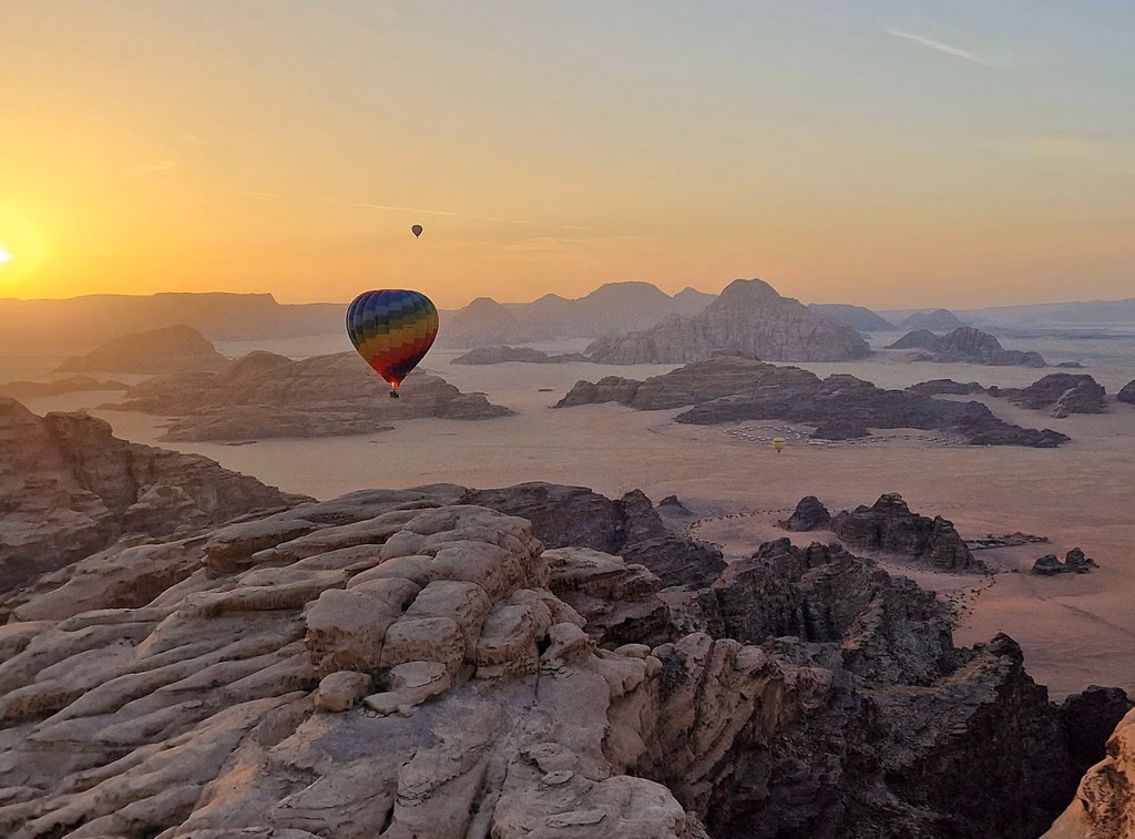 Hot Air Balloon floating above Wadi Rum Jordan at sunset