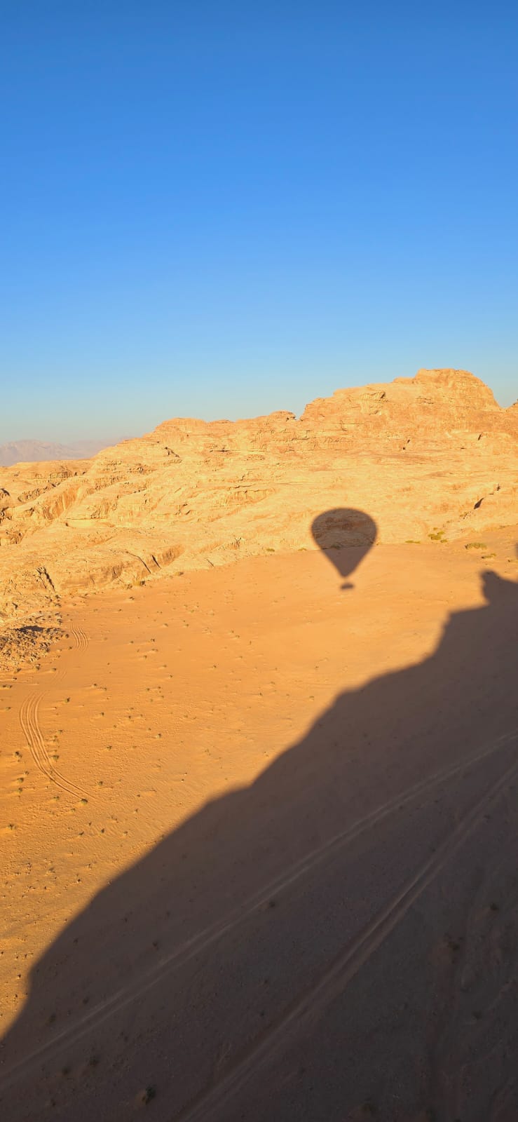 Shadow of a hot air balloon on Wadi Rum Desert, Jordan