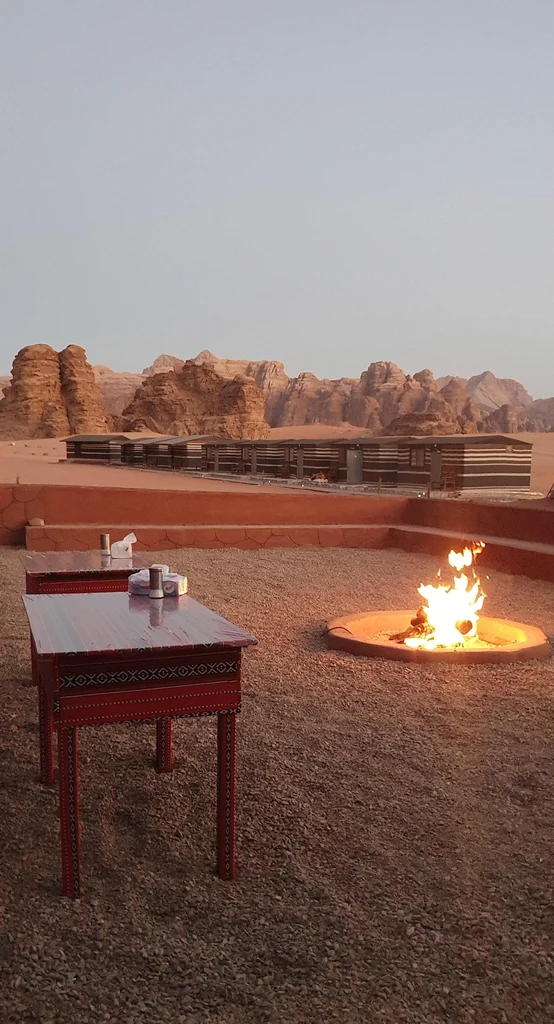 Fire pit and low seating in the camp courtyard