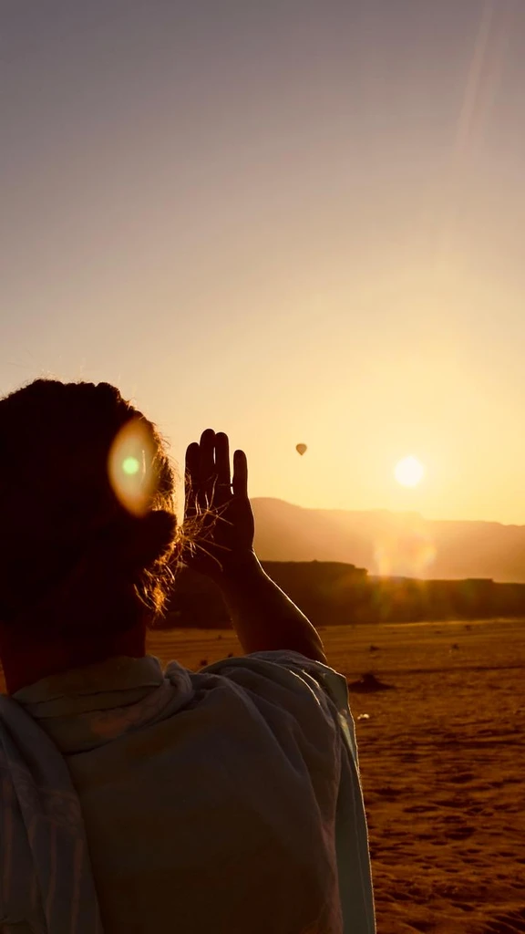 Sunset and hot air balloon in Wadi Rum