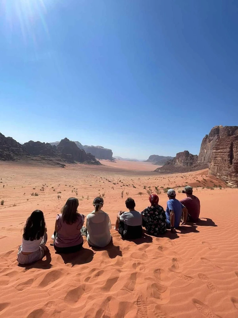 Guests sitting and admiring Wadi Rum Desert in Jordan